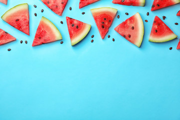Slices of ripe watermelon on color background, top view with space for text © New Africa