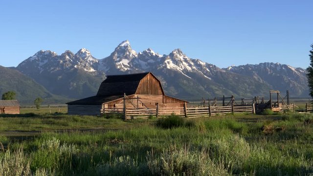 early morning clip of a mormon row barn and grand teton mountain in grand teton national park, usa