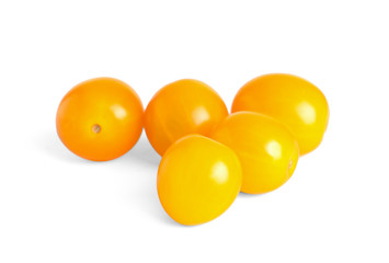 Tasty yellow cherry tomatoes on white background