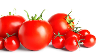 Tasty red tomatoes on white background