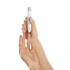 Woman using lancet pen on white background. Diabetes test