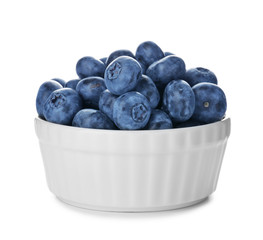 Bowl with tasty blueberry on white background