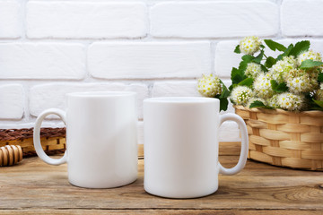 Two coffee mug mockup with basket of flowers