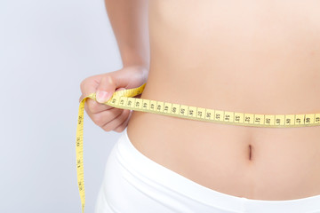 Asian woman diet and slim with measuring waist for weight isolated on white background, girl have...