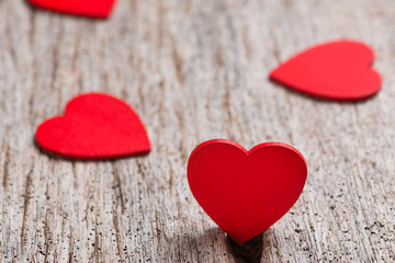 Red heart made from wood on wooden background