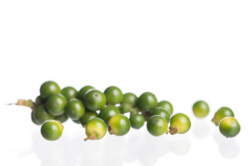 Fresh black pepper on white background