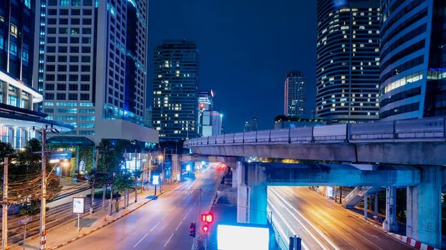 4k Time lapse, night traffic and sky train at Chong Nonsi, Bangkok Thailand. 
