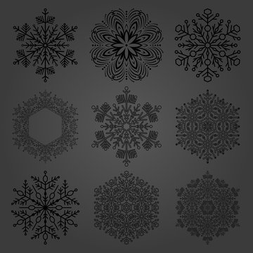 Set of vector black snowflakes. Fine winter ornaments. Snowflakes collection. Snowflakes for backgrounds and designs