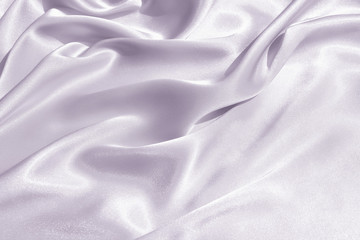 The texture of the satin fabric of lilac color for the background 