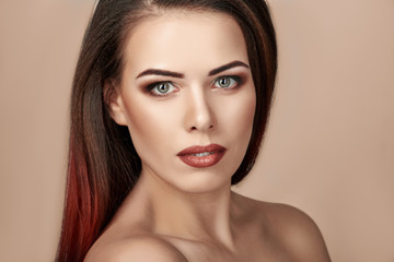 Portrait of gorgeous young brunette woman with bright makeup