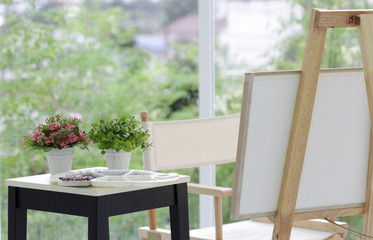 art cornner with color and palette at drawing room with fresh plant and green nature.