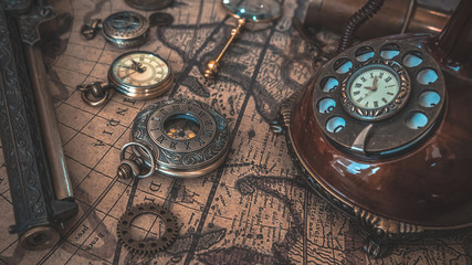 Vintage Watch, Gun, Magnifying Glass And Telephone On World Map