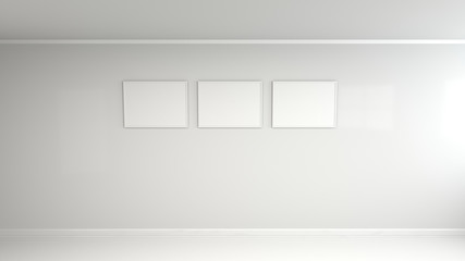 Blank white poster in white frame on the wall