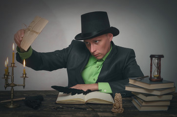 Man in bowler destroys a top secret documents by the fire of candle. Detective or spy agent or...
