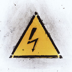 Yelloy Danger Sign on White Weathered Background, Old Metal Textured