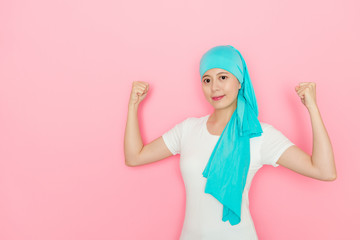 Fototapeta na wymiar cancer patient woman showing powerful arm