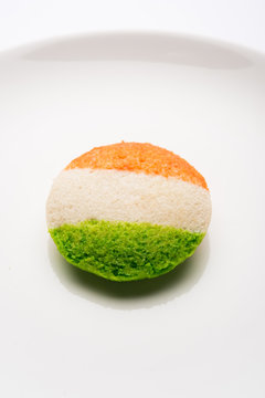 Tiranga Idly or Idli made using Indian National Flag colours like saffron, white and green. Served with colourful chutney. Concept for Happy Independence day greeting card