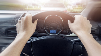 Close up of man hand control wheel