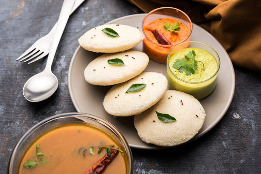 Idly Sambar Or Idli With Sambhar And Green, Red Chutney. Popular South Indian Breakfast