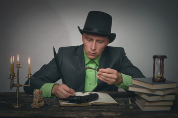 Detective agent collecting a compromising evidence and searching for fingerprint. Key to...
