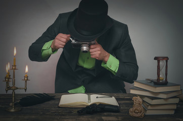 Detective agent collecting a compromising evidence and searching for fingerprint. Detective or spy...