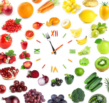 Food clock with fresh fruits and vegetables