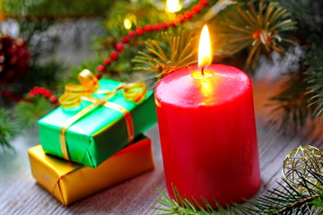 Burning candles with christmas decorations