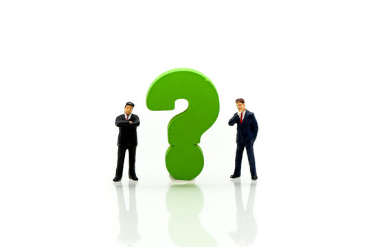 Miniature people : Businessman with THE QUESTION MARK using for concept Punctuation Day
