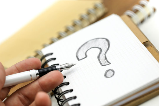 Miniature people : Businessman with THE QUESTION MARK using for concept Punctuation Day