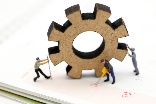Miniature people : Worker and tool with Calendar Using for concept Calendar Adjustment Day.