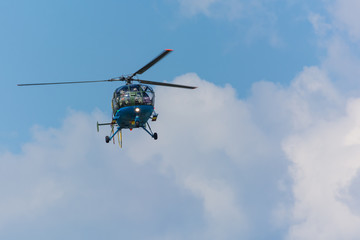 Fototapeta na wymiar A Helicopter Sending its Greetings at an Airshow