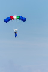 A Colourful Parachute Descending from the Sky at the Airshow