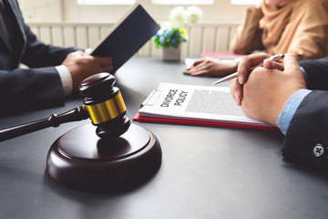 The couple consulting a lawyer about divorce agreement.