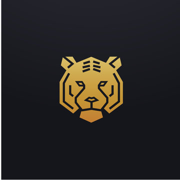 Stylized tiger head icon illustration. Vector glyph, tribal feline wild animal design with golden color