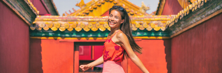 China travel Asian woman tourist smiling happy in Beijing city, panoramic banner young people lifestyle. © Maridav