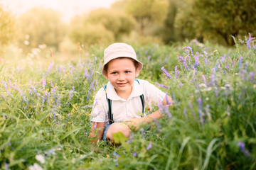 Boy looks high in the sky. Closeup.