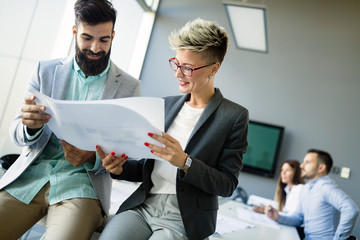 Picture of business colleagues talking in office