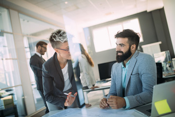Picture of young architects discussing in office