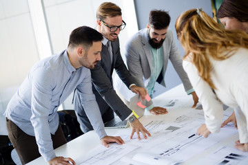 Team of architects working on construction plans