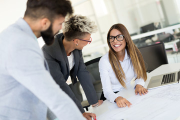 Picture of young architects discussing in office