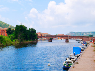 View of the river and fishing boats in the city of Bosa. province of Oristano, Sardinia, Italy.