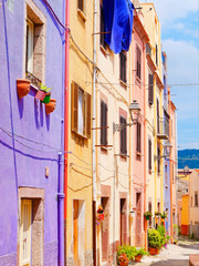 Fototapeta na wymiar View of the beautiful, colorful, narrow street in Bosa. province of Oristano, Sardinia,
