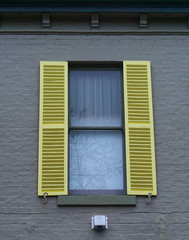 Window with yellow shutters