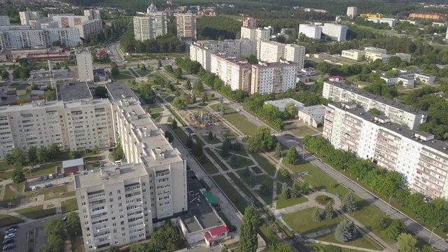 Residential multi-storey houses and buildings in the city of Netishin near Khmelnitsky nuclear power plant in Ukraine. Aerial view. Summer day with a cloudy sky