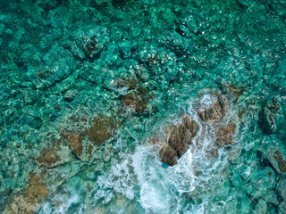 Sunny clear sea water from above