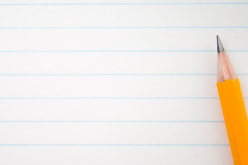 Back to school, education concept with orange pencils close up and composition book on background for educational new academic year begin or study term start. Mock-up Copy space