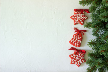 Christmas New Year holiday background, red gingerbread cookies on white table. Copy space.