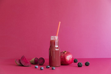 Healthy red smoothie with red vegetables and fruit lie on the table. Detox diet for healthy body and mind.