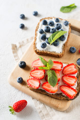Strawberry and blueberry toast on breakfast. Healthy food