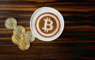 Printed on coffee printer bitcoin symbol. New technology